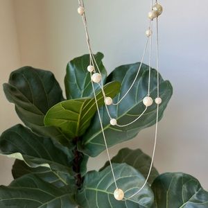 Multilayered faux pearl silver tone metal chain long necklace